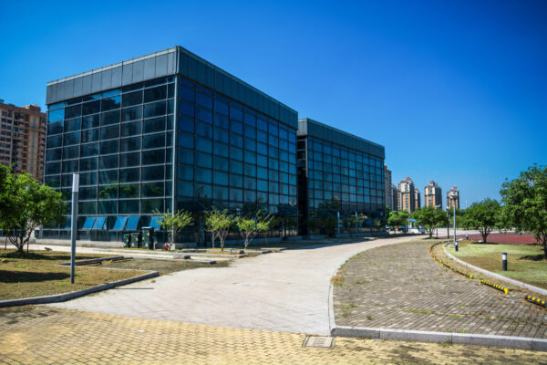 Modern office building with traffic in motion blur