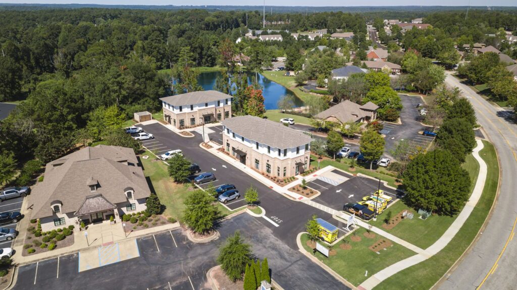 Aerial view of North Dean Offices, two office buildings beside a pond in Auburn, Alabama