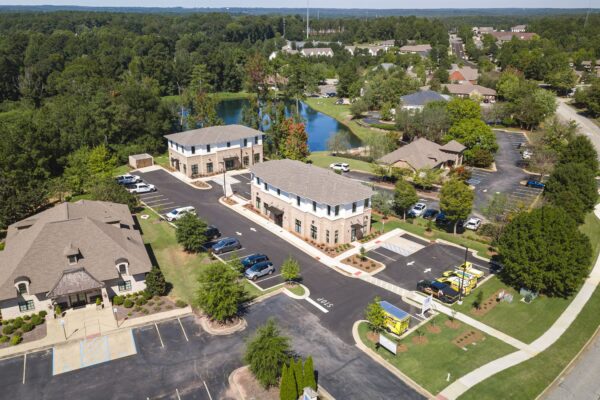 Aerial view of North Dean Offices, two office buildings beside a pond in Auburn, Alabama