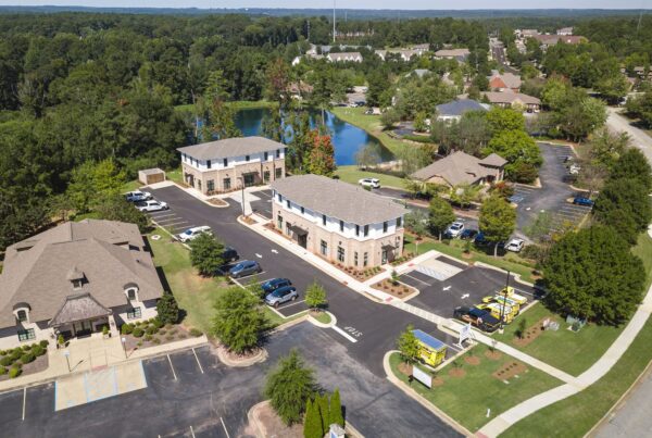 Aerial view of North Dean Offices, two office buildings beside a pond in Auburn, Alabama