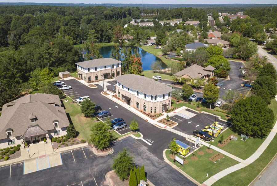 Aerial view of North Dean Offices, two office buildings beside a pond in Auburn, Alabama